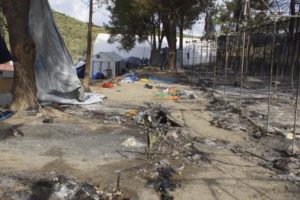 epa05548945 Burnt tents following clashes between groups of refugees and migrants of different nationalities at the camp of Moria on Lesvos (Lesbos) island, Greece, 20 September 2016. Migrants set fire to several parts of the camp which then spread causing hundreds of people to flee. Authorities evacuated the area where unaccompanied minors were living and transferred them to a new facility. Earlier today, rumours that mass returns to Turkey were imminent prompted renewed incidents and a break-out from the hotspot who attempted to set off on a protest march to Mytilene, the island's main town, but were stopped and forced to turn back by police.  EPA/STRATIS BALASKAS